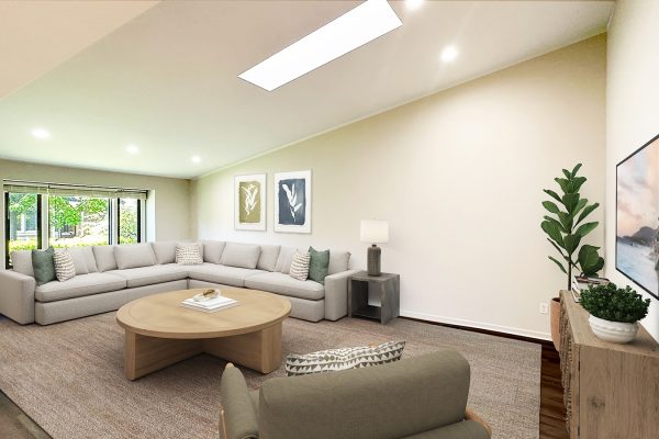 Modern living room with beige sectional sofa, large windows, wooden table, and indoor plants.