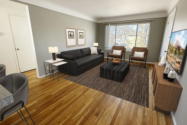 Modern living room with wooden floor, gray sofa, TV, and large window, styled with contemporary decor and furniture.